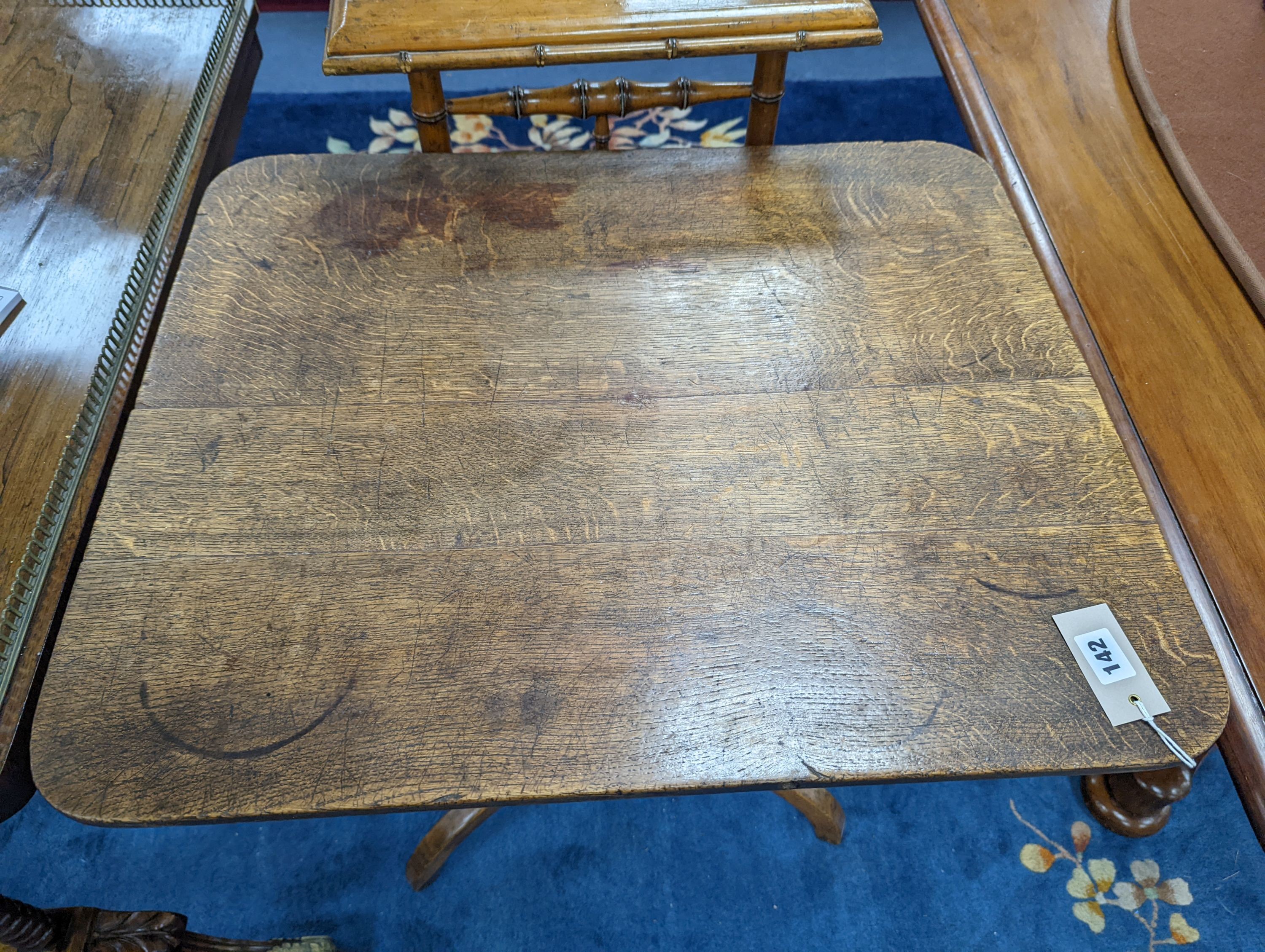 A Victorian rectangular oak tilt top tripod tea table, width 67cm, depth 56cm, height 74cm